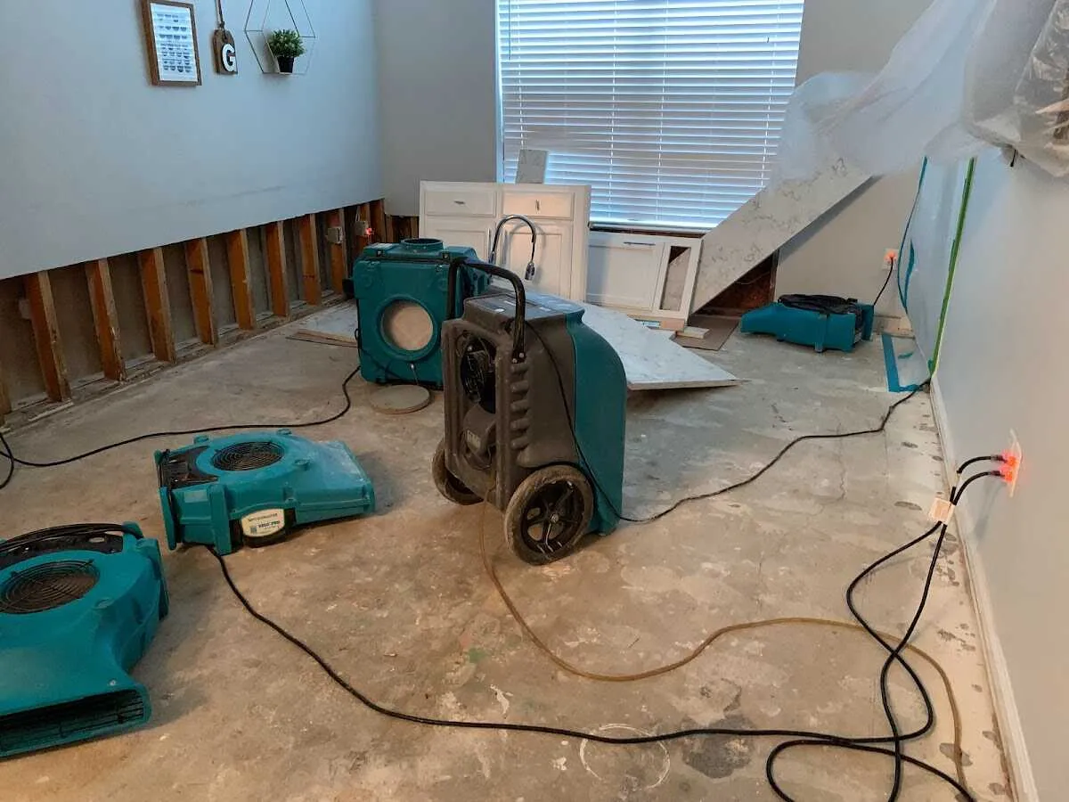 Dehumidifier in flood-cut room for Water Damage Restoration in Belvedere Park